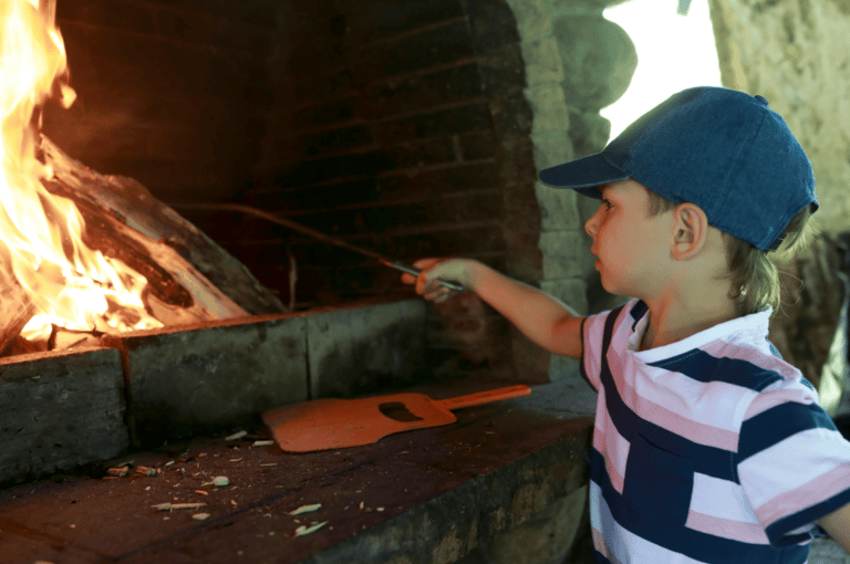Child about to be burnt on a fire.